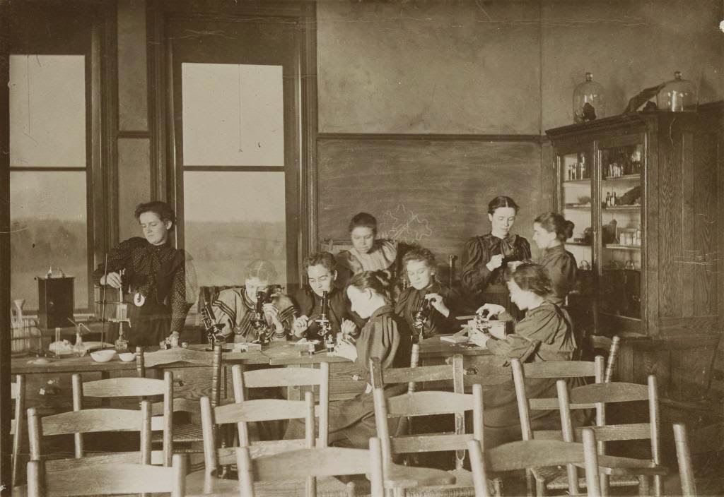 Bryant (standing center) and students in the State Normal School's laboratory, circa 1893. This photograph appears in Bryant's scrapbook and is courtesy of the University of North Carolina Greensboro University Libraries.