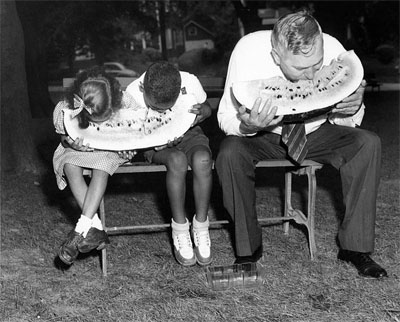 Governor Gregg Cherry eating watermelon with children, 1945-1949.  Image from the collections of the North Carolina Museum of History, used courtesy of the North Carolina Department of Cultural Resources. 