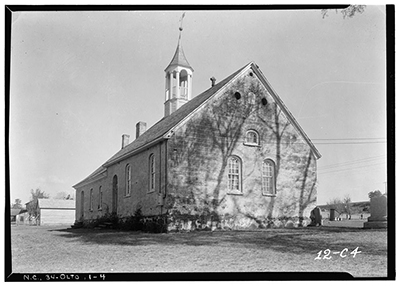 Black and white photograph of Gemeinhaus at Bethabara taken in 1934. Many of the structures of Bethabara -- established in 1753 -- including this Moravian Church, are still standing today in Forsyth County. Image courtesy of Library of Congress