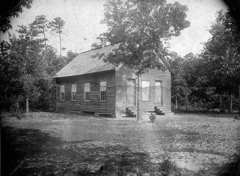 Photograph of an old one-room school in Wayne County, N.C., ca. 1900. The building was typical of the rural schools established in the 19th century. From the collections of the State Archives of N.C.
