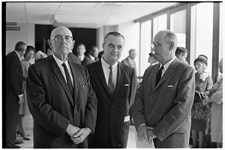 Photograph of dedication of superintendent of Pitt County Schools in 1967. D.H. Conley, former superintendent at the time, stands on the left. Image 741.44.a.32, from the Daily Reflector Image Collection, East Carolina University Digital Collections.
