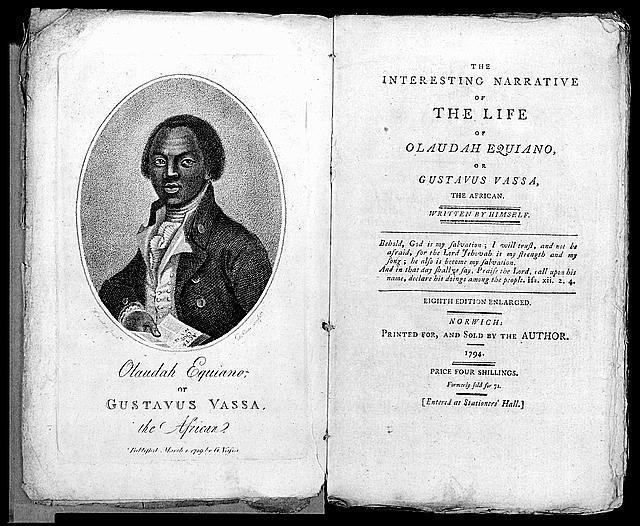 Olaudah Equiano Olaudah Equiano pictured in his book. He is wearing a scarf, vest and jacket. His hair is parted. He is holding a book with a serious expression. He is young.