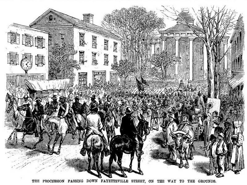 The procession passing down Fayetteville Street, on the way to the grounds. The procession passing down Fayetteville Street, on the way to the grounds.