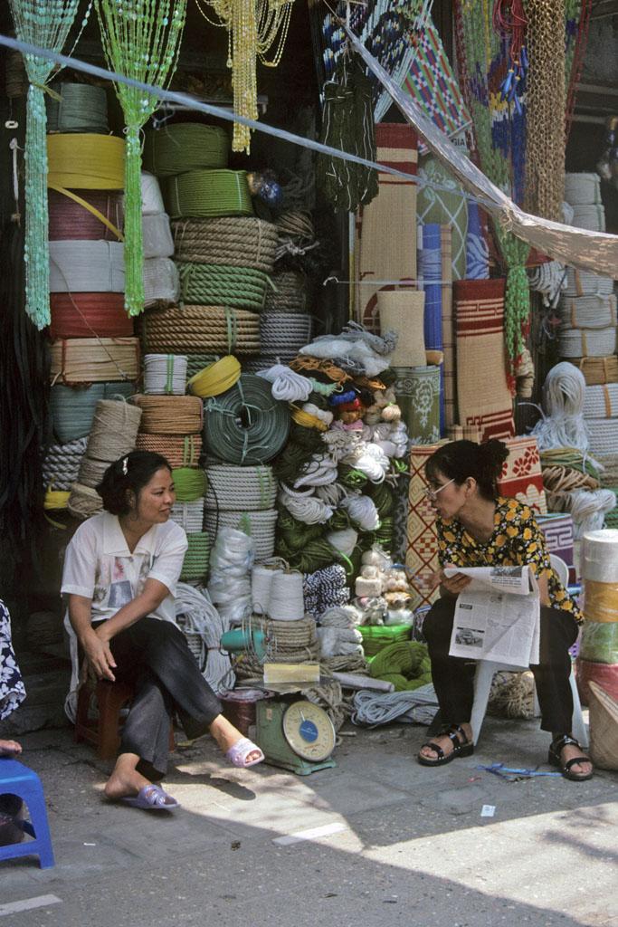 <img typeof="foaf:Image" src="http://statelibrarync.org/learnnc/sites/default/files/images/vietnam_010.jpg" width="683" height="1024" alt="Two women sit talking outside a rope and mat shop in Hanoi" title="Two women sit talking outside a rope and mat shop in Hanoi" />