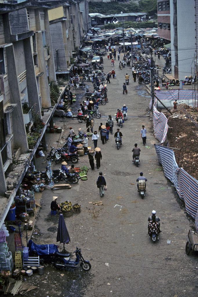 <img typeof="foaf:Image" src="http://statelibrarync.org/learnnc/sites/default/files/images/vietnam_032.jpg" width="683" height="1024" alt="Elevated view of vendors, pedestrians, and motorcycles at urban market in Dalat" title="Elevated view of vendors, pedestrians, and motorcycles at urban market in Dalat" /> <img typeof="foaf:Image" src="http://statelibrarync.org/learnnc/sites/default/files/images/vietnam_032.jpg" width="683" height="1024" alt="Elevated view of vendors, pedestrians, and motorcycles at urban market in Dalat" title="Elevated view of vendors, pedestrians, and motorcycles at urban market in Dalat" />