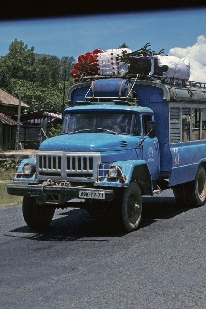 <img typeof="foaf:Image" src="http://statelibrarync.org/learnnc/sites/default/files/images/vietnam_035.jpg" width="683" height="1024" alt="Front of blue bus with rooftop cargo on road from Dalat to Ho Chi Minh City" title="Front of blue bus with rooftop cargo on road from Dalat to Ho Chi Minh City" />