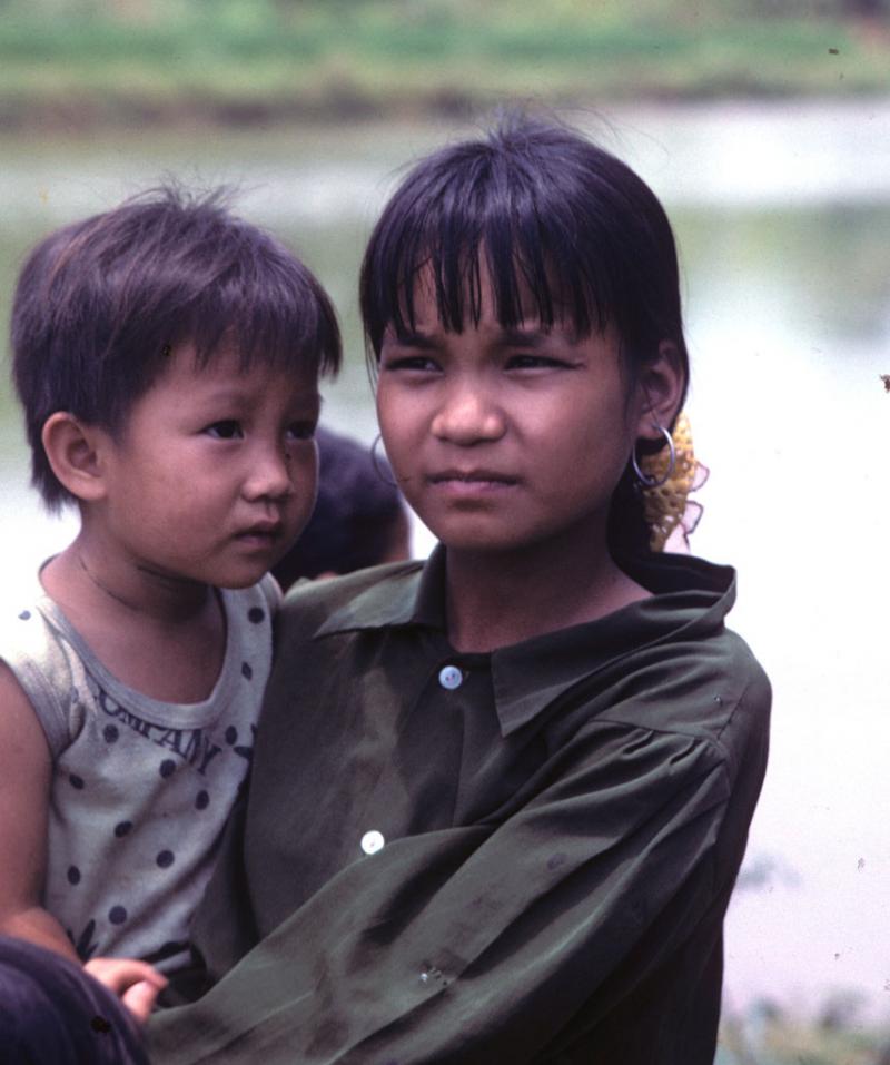 <img typeof="foaf:Image" src="http://statelibrarync.org/learnnc/sites/default/files/images/vietnam_061.jpg" width="856" height="1024" alt="Highland girl holds younger child in Vietnam" title="Highland girl holds younger child in Vietnam" />