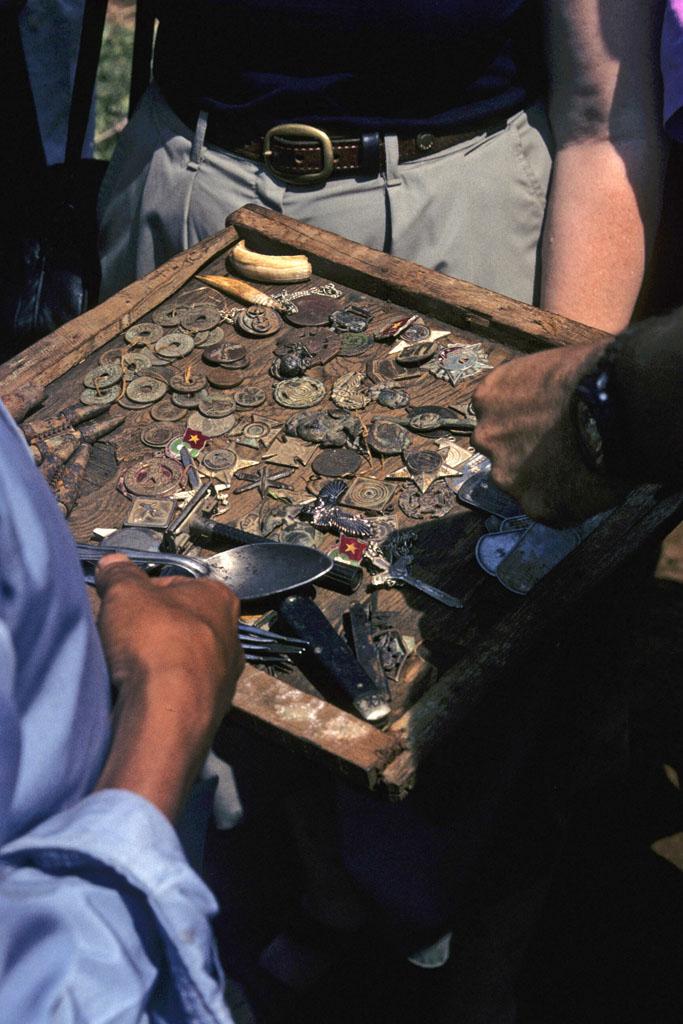 <img typeof="foaf:Image" src="http://statelibrarync.org/learnnc/sites/default/files/images/vietnam_084.jpg" width="683" height="1024" alt="Tray filled with military badges and other artifacts from the Vietnam wars" title="Tray filled with military badges and other artifacts from the Vietnam wars" />