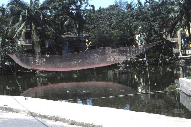 <img typeof="foaf:Image" src="http://statelibrarync.org/learnnc/sites/default/files/images/vietnam_104.jpg" width="1024" height="683" alt="Large empty fish net suspended over harbor at Hoi An" title="Large empty fish net suspended over harbor at Hoi An" />