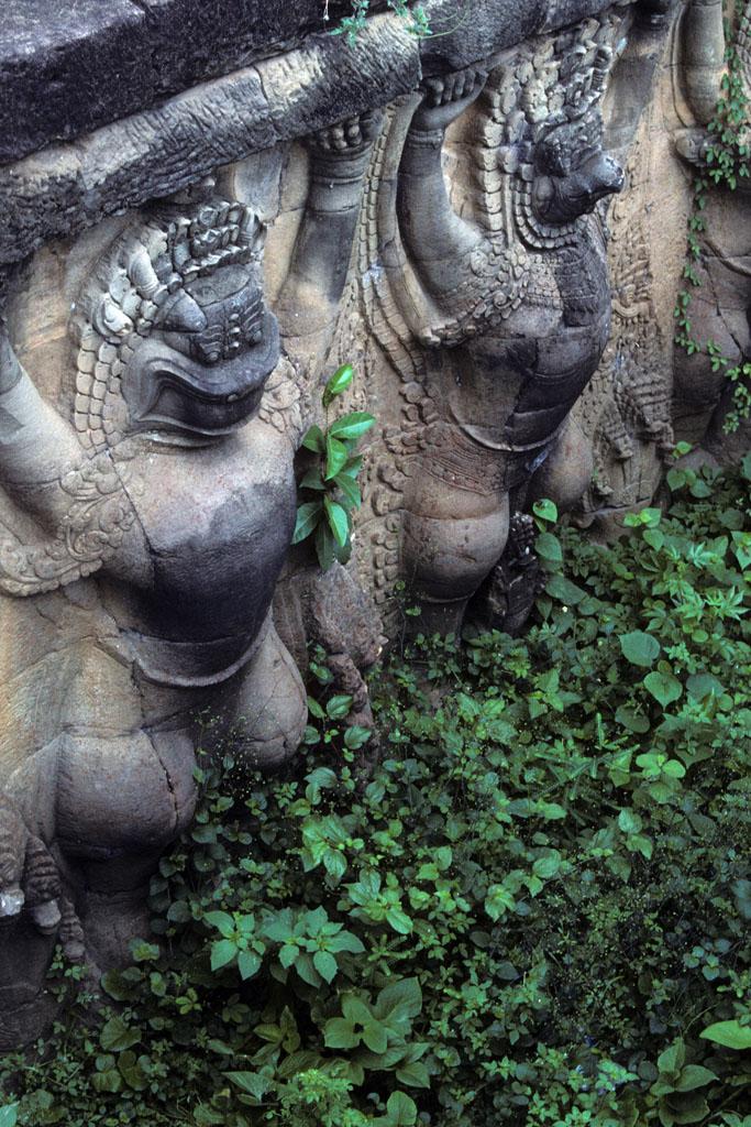 <img typeof="foaf:Image" src="http://statelibrarync.org/learnnc/sites/default/files/images/vietnam_211.jpg" width="683" height="1024" alt="Carved stone reliefs of Garuda supporting Elephant Terrace at Angkor Thom" title="Carved stone reliefs of Garuda supporting Elephant Terrace at Angkor Thom" />