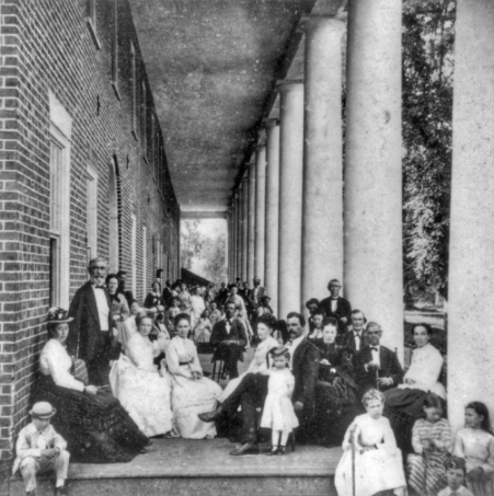Guests on the portico of the hotel at Hot Springs, ca. 1873. Photograph by Rufus Morgan. North Carolina Collection, University of North Carolina at Chapel Hill Library.