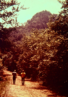 Photograph of hikers on trail at Crowders Mountain State Park, ca. 1975. From the collection of North Carolina State Parks.