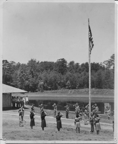 Scouts saluting the American Flag, grand opening of the community park in Mayodan,  N.C. on July 3, 1948. Today the site is Mayo River State Park. From the North Carolina State Parks Collection, NC Digital Collections.