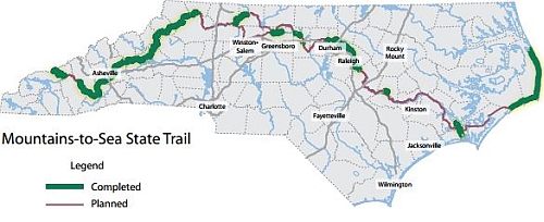 Map illustration of the N.C. Mountains-To-Sea State Trail, with existing trail segments shown in green and planned portions shown in red. From <i>North Carolina State Parks Naturally Wonderful</i>, North Carolina Division of Parks and Recreation, December 2013.</a> NC State Documents Collection, NC Digital Collections.
