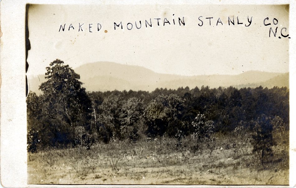 "Naked Mountain Stanly Co N.C." Photograph ca. 1920s. For a time the mountain was called Naked Mountain, named for its appearance following timber loss during a hurricane of February 1884. The mountain was subsequently renamed "Morrow" for James Morrow who later purchased the land. From the collection of the Stanly County Museum, Albemarle, N.C. 