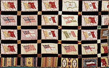 Closeup of center medallion style quilt made with “Flags of the World” and “Indian Blankets” flannel advertising inserts from American Tobacco Company,  made ca. 1915, Durham County, N.C. From the collections of the North Carolina Museum of History, used courtesy of the North Carolina Department of Cultural Resources. 