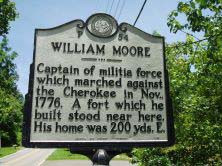 This is an image of a North Carolina Highway Historical Marker that is of William Moore and is located at SR 3412 (Sand Hill Road) east of Enka in Buncombe County. The marker text reads: Captain of militia force which marched against the Cherokee in November, 1776. A fort which he built stood near here. His home was 200 yards east.