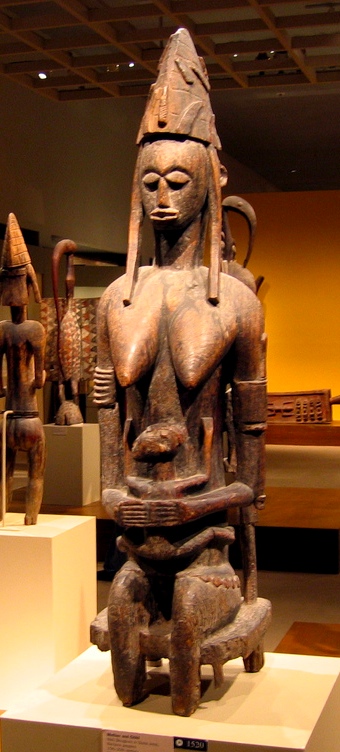 Woman-and-child figures are visual metaphors for both individual and societal fertility among West African peoples and reflect their matrilineal social organization, that is, tracing their kinship through their mother’s side of the family.