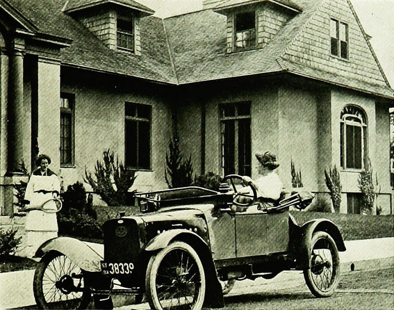 A car in front of a suburban home, 1915