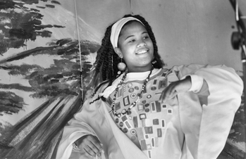 Dancer at the Community Village on South State Street during a Kwanzaa celebration in Raleigh, 17 Dec. 1999. Photograph by Bernard Thomas. Durham Herald-Sun.