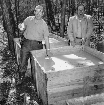 Law enforcement officers test the evidence during a raid on an illegal liquor distillery in the Eno Township of Orange County in 1958. Photograph by Roland Giduz. North Carolina Collection, University of North Carolina at Chapel Hill Library.