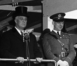 A photograph of Albert Lyman Cox (right) next to president Franklin D. Roosevelt at the April 6, 1938 Army Day Parade in Washington, D.C. Image from the Library of Congress.