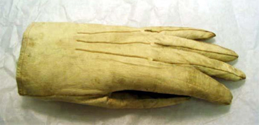 Photograph of the glove, a military uniform accessory circa 1860-65, of James I. Waddell, worn in the United Kingdom and France. Glove held in the collections of the North Carolina Museum of History. 