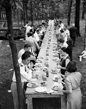 Enjoying a meal of pit-cooked barbeque with friends and family, Braswell Plantation near Rocky Mount, NC, September 1944. From Conservation and Development Department, Travel and Tourism Photo Files, North Carolina State Archives, call #:  ConDev4648B, Raleigh, NC.
