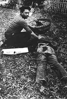 "Nelson Johnson at the body of Dr. James Waller, November 3, 1979, Greensboro, NC. "