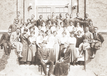 Slater Industrial Academy 1915 student body and Dr. and Mrs. Simon Green Atkins. Dr. and Mrs. Atkins are sitting in front of the students. Image available from Digital Forsyth. 